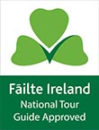 Fáilte Ireland National Tour Guide Approved logo with green shamrock and checkmark.